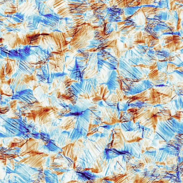 Nitinol is a shape-memory metal: you can stretch it, bend it, squash it, twist it… but heat it up, and it springs right back to its original shape. This image shows the microstructure – the tiny shifts of crystal atoms that remember their old shape, ready to jump right back into position. 